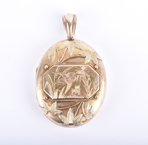 Lot 857 - A Victorian yellow gold locket of oval form,...