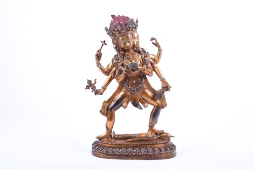 Lot 118 - A Tibetan gilt bronze and jewelled figure of...