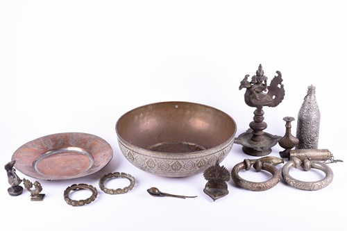 Lot 214 - A Tibetan cast bronze oil lamp, hentha weights,...