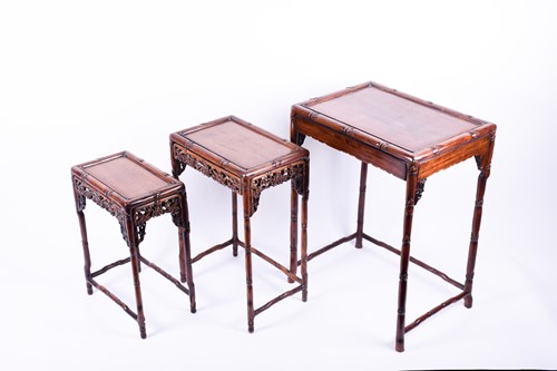 Lot 111 - A set three Chinese hongmu carved nesting...