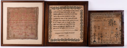 Lot 297 - Three framed 19th century needlework samplers,...