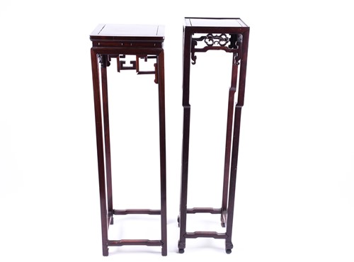 Lot 162 - Two Chinese hardwood tall urn stands, with...