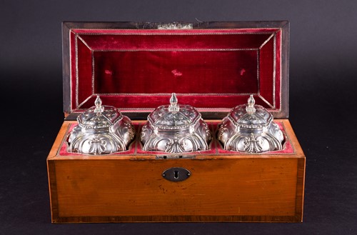 Lot 469 - A set of three early George III silver tea...