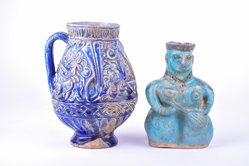 Lot 200 - A Persian blue glazed calligraphic jug,...