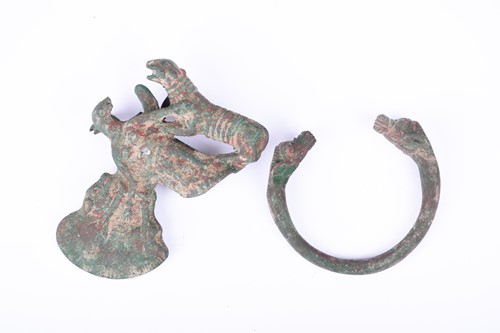 Lot 314 - An unusual cast metal axe head, cast as a...