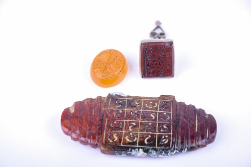 Lot 210 - A Persian silver metal mounted fob seal with...