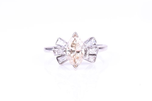 Lot 580 - An unusual white metal and diamond ring set...