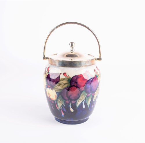 Lot 55 - A William Moorcroft Wisteria pattern biscuit...