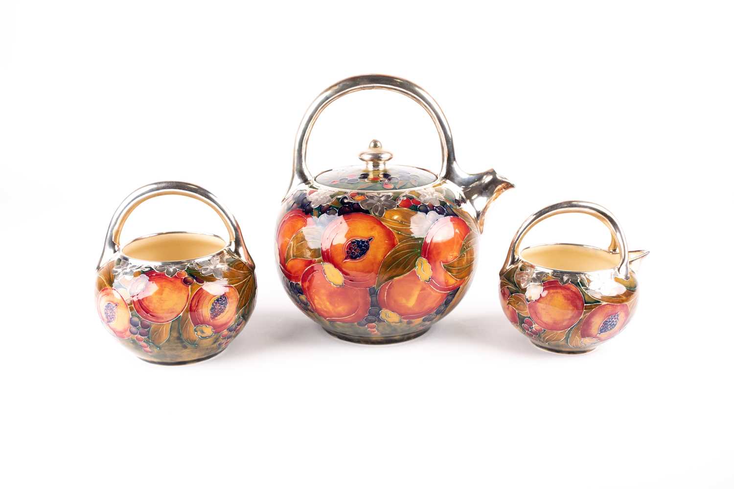 Lot 58 - A rare William Moorcroft silver overlaid...