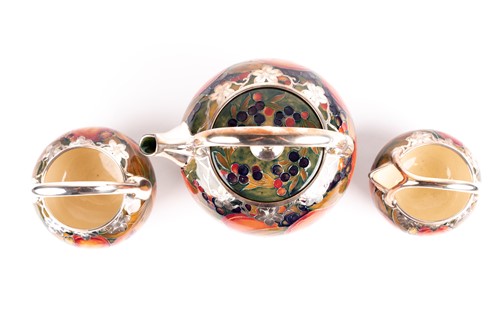 Lot 58 - A rare William Moorcroft silver overlaid...
