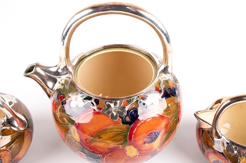 Lot 58 - A rare William Moorcroft silver overlaid...
