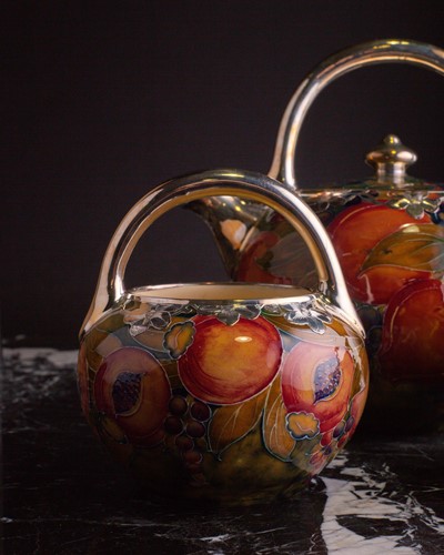 Lot 58 - A rare William Moorcroft silver overlaid...