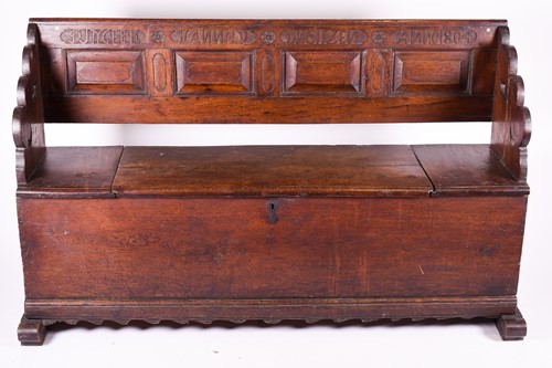 Lot 121 - An early 19th oak church pew, with cushioned...