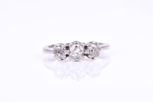 Lot 591 - A platinum and diamond three stone ring, set...