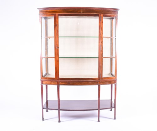 Lot 141 - A late 19th century mahognay bow-front display...