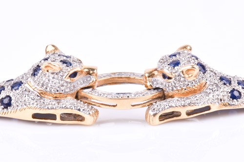 Lot 720 - An unusual yellow metal, sapphire, and diamond...