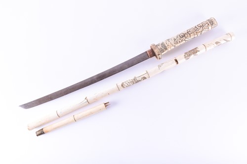 Lot 243 - A Japanese carved bone sword stick, circa 1900,...