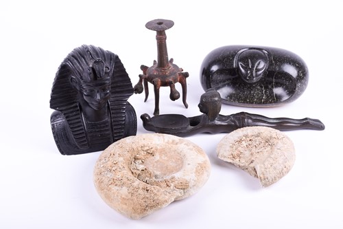 Lot 328 - A bronze oil lamp, modelled as a female laying...