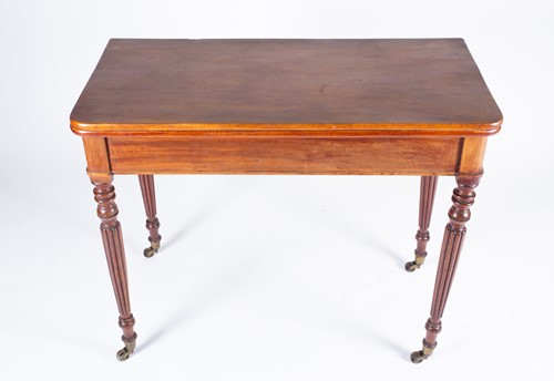 Lot 170 - A Regency mahogany foldover tea table, with...