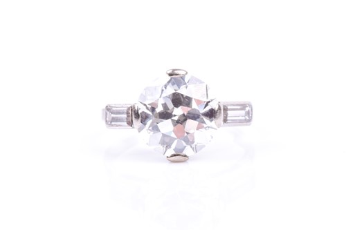 Lot 565 - An impressive round brilliant-cut solitaire...