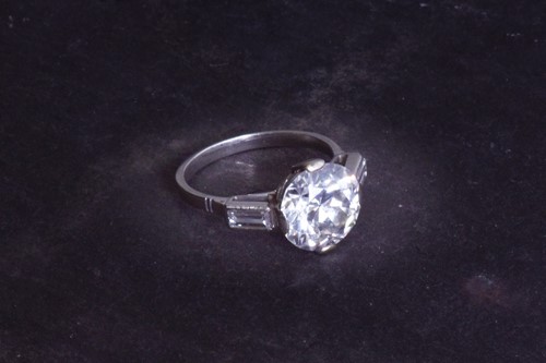 Lot 565 - An impressive round brilliant-cut solitaire...