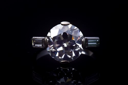 Lot 565 - An impressive round brilliant-cut solitaire...