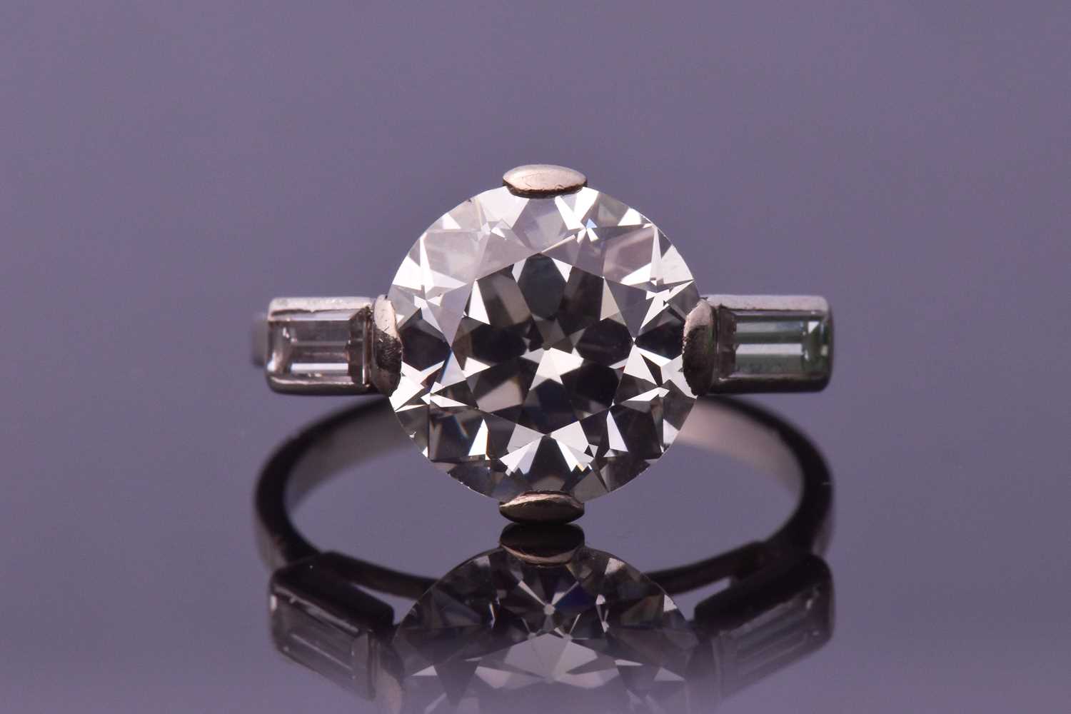 Lot 565 - An impressive round brilliant-cut solitaire...