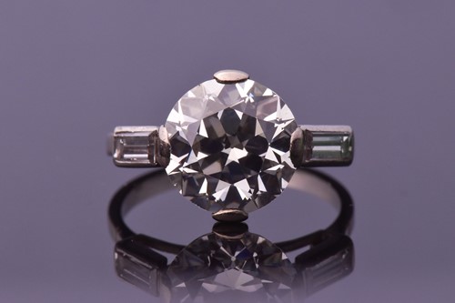 Lot 565 - An impressive round brilliant-cut solitaire...