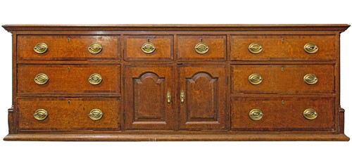 Lot 102 - A George III oak dresser base, the rectangular...