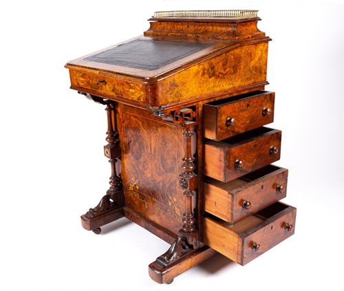 Lot 93 - A Victorian figured walnut Davenport, the top...