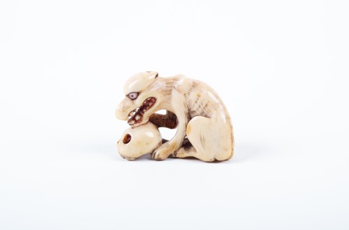 Lot 120 - A Japanese carved ivory okimono, 19th century,...