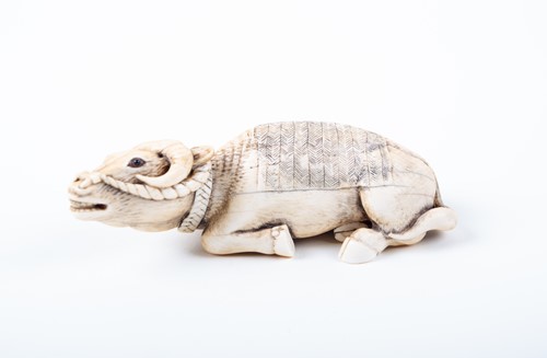 Lot 141 - A Japanese ivory okimono, 19th century, carved...