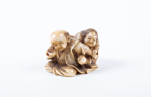 Lot 160 - A humorous Japanese netsuke, Meiji, carved as...