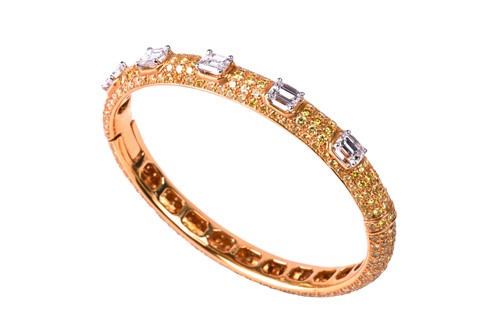Lot 218 - Graff. An 18ct yellow gold and diamond bangle,...