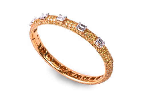 Lot 218 - Graff. An 18ct yellow gold and diamond bangle,...