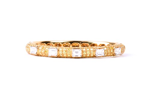 Lot 218 - Graff. An 18ct yellow gold and diamond bangle,...