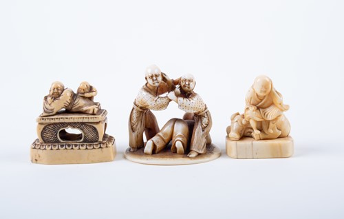 Lot 131 - A Japanese ivory okimono and two netsukes,...