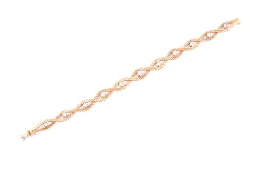 Lot 777 - A 1970s 18ct yellow gold and diamond bracelet,...