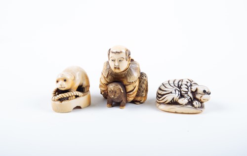 Lot 155 - A Japanese ivory okimono and two netsukes,...
