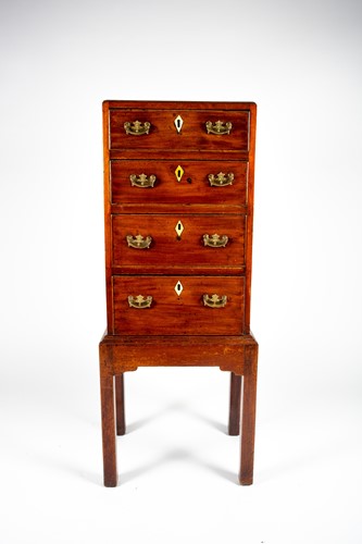 Lot 103 - A small George III mahogany chest on stand,...