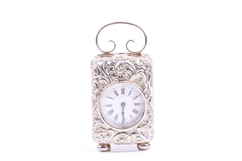 Lot 19 - A Victorian miniature repousse silver cased...