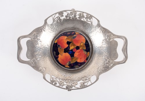 Lot 252 - A Liberty Tudric hammered pewter twin-handled...