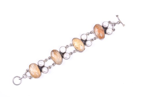 Lot 485 - A silver, citrine, and blister pearl bracelet,...