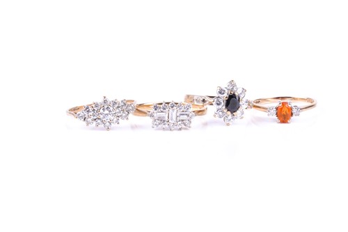 Lot 591 - A three stone half hoop fire opal and diamond...