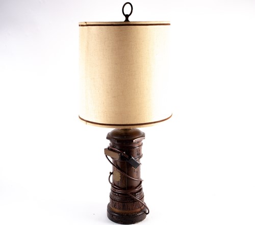 Lot 374 - An early 20th century wooden lamp, modelled as...