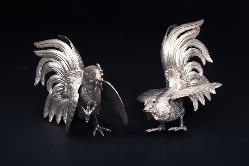 Lot 41 - A pair of silver fighting cocks, realistically...