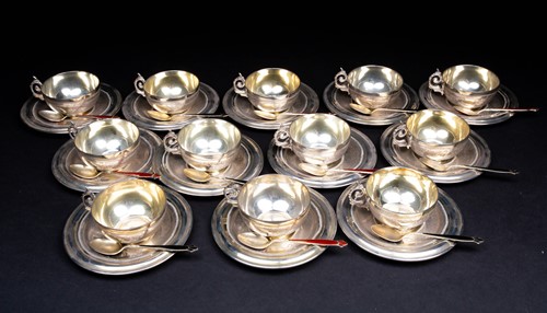 Lot 34 - A set of twelve Syrian silver dowry cups and...