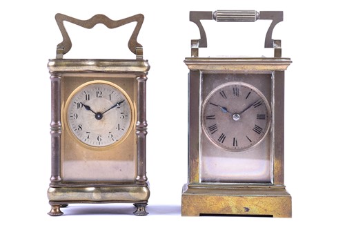 Lot 419 - Two late 19th century gilt brass four-glass...