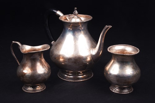Lot 570 - A Continental white metal three-piece teaset,...