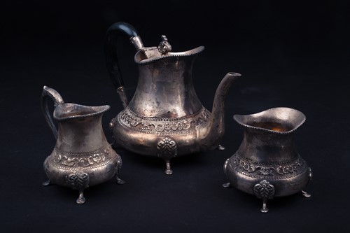 Lot 77 - A Continental white metal three-piece teaset,...